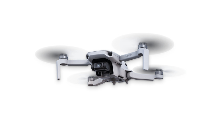 The DJI Mini 4K over a white background