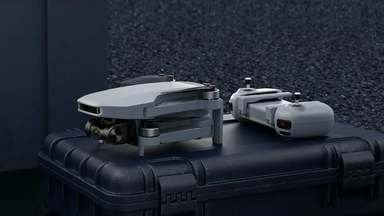 The Potensic Atom SE with its controller on a crate