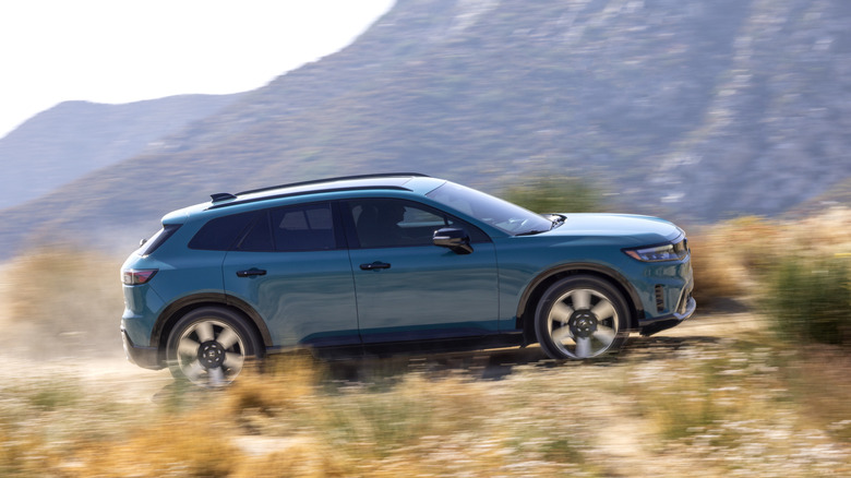 2025 Honda Prologue side view driving fast on trail