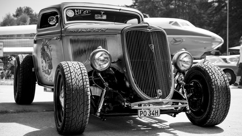 Black and white photo hot rod front three quarter view