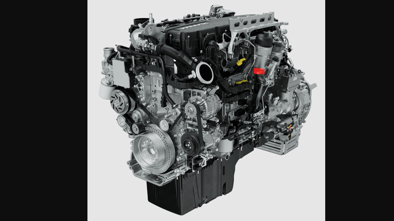 A silver Paccar Mx-13 engine, top-side view.