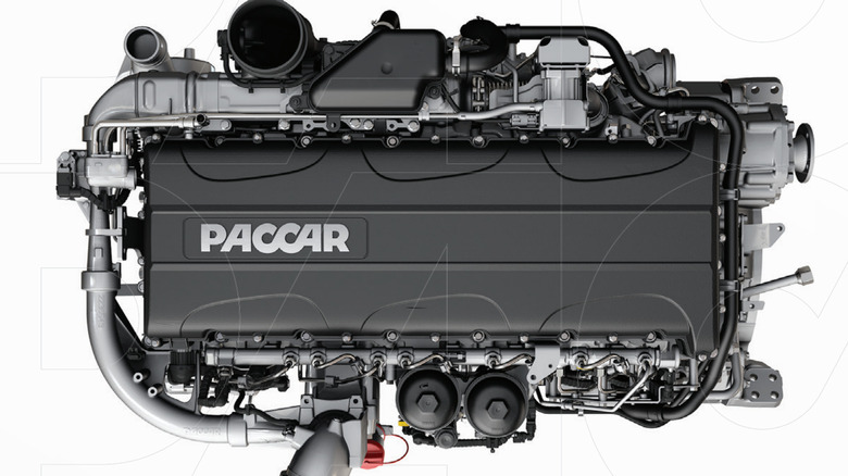 A silver Paccar Mx-11 engine, top-side view.