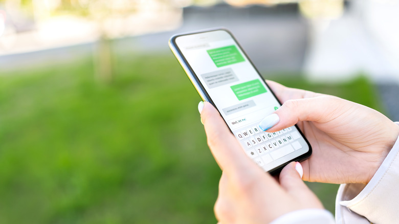 woman texting with green bubbles