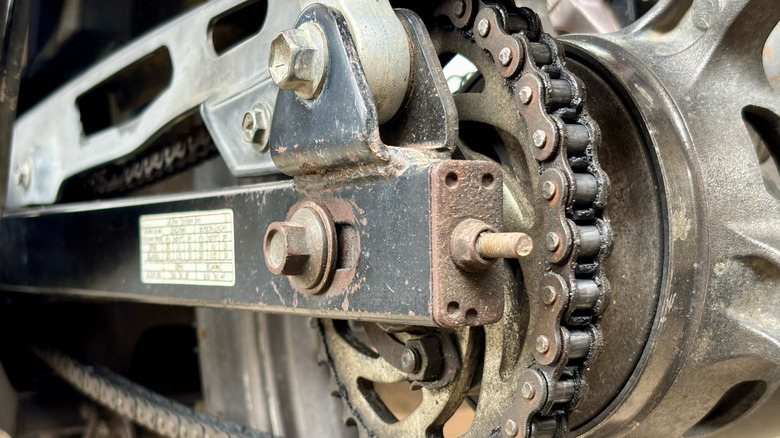 Detailed view of motorcycle chain and sprockets