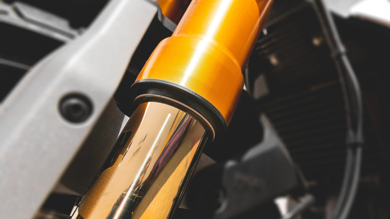 A closeup of a motorcycle fork and seal