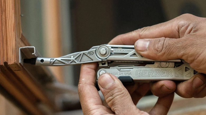 A person using screwdriver present in the Gerber Center-Drive Plus multitool