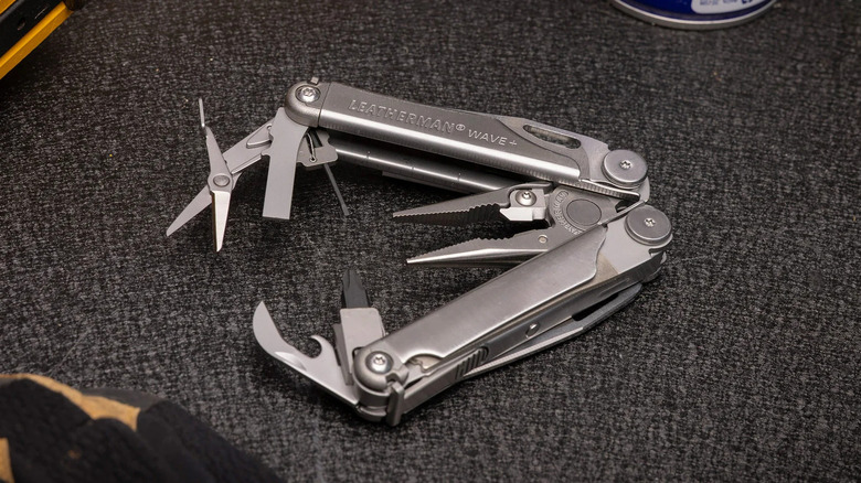 The Leatherman Wave+ multitool on a grayish-black surface