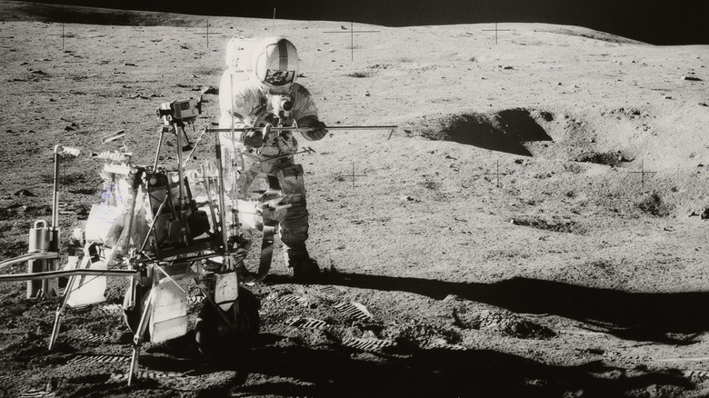 Apollo 14 astronaut with rickshaw cart