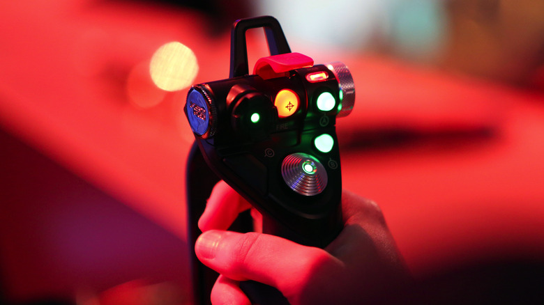 hand holding joystick controller
