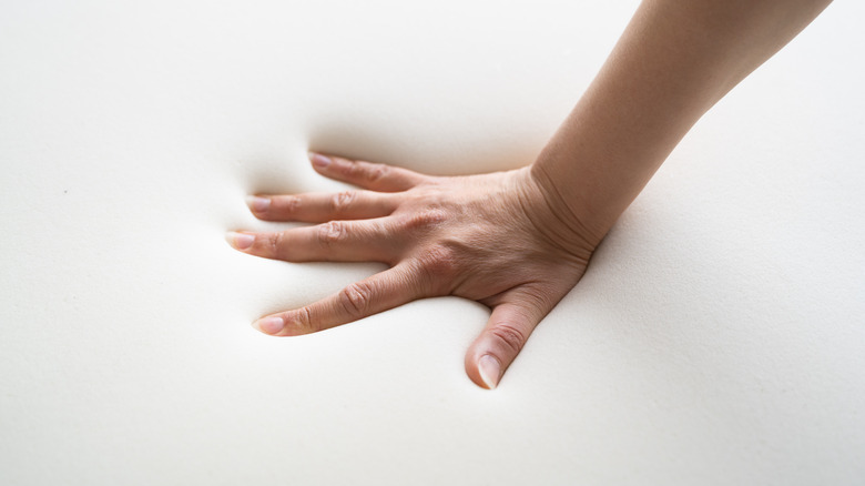 pressing on memory foam mattress