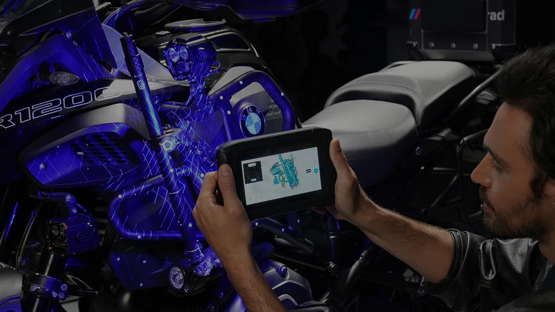 A person using a Creality Sermoon P1 3D scanner