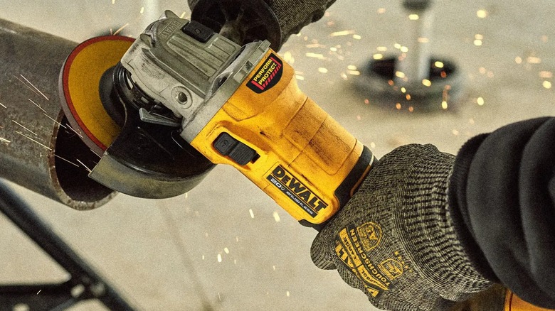 knocking burr off pipe edge with DeWalt grinder