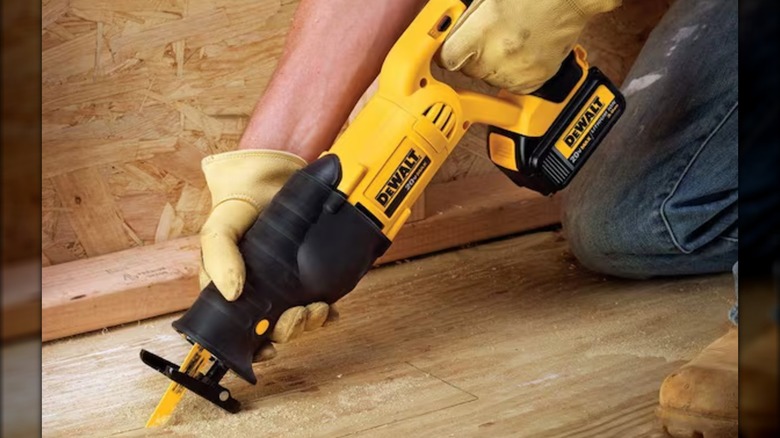 cutting through floorboards with reciprocating saw