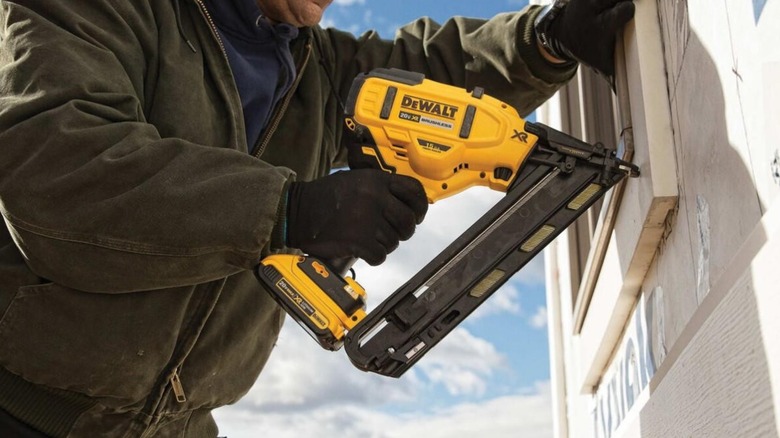 installing window trip with finish nailer