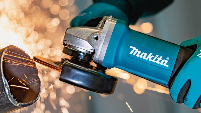 A Makita angle grinder creating sparks