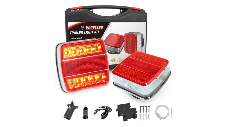 Stock photo of two tail lights with adapters and accessories
