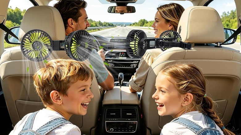 Dual head fan attached to the back head rest of a car