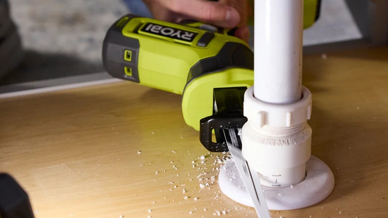 cutting a pipe with Ryobi reciprocating saw