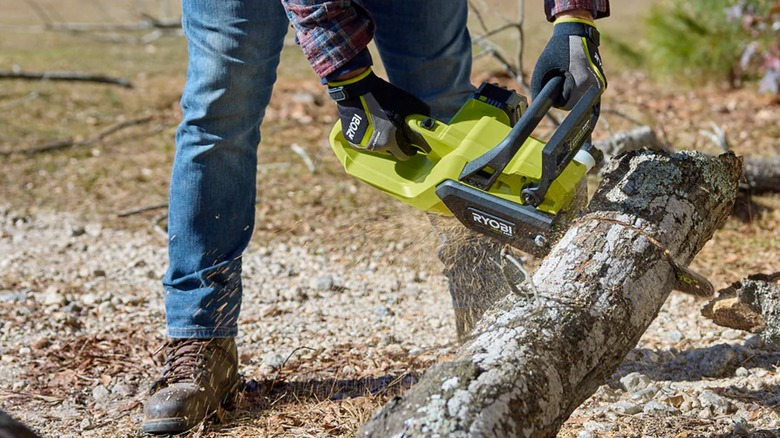cutting log with Ryobi chainsaw