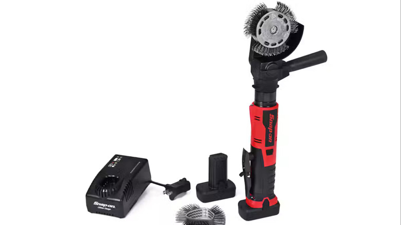The crud thug kit with the tool, charger, battery, and spare bristle wires
