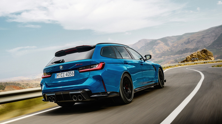 2025 BMW M3 CS Touring dynamic image rear 3/4 view