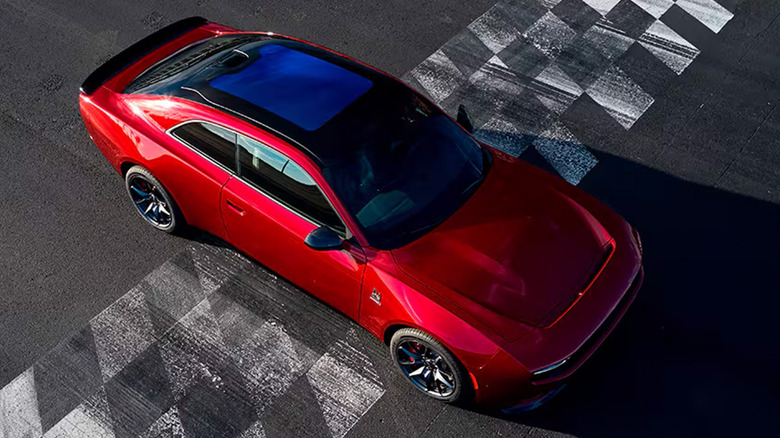 A red Dodge Challenger on a race track