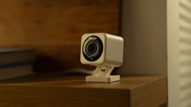 Wyze Wired 2.5k Floodlight Pro and Indoor/Outdoor Security Camera on a table