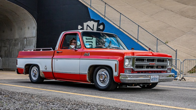 Wide angle front corner view of a 1976 GMC Sierra Classic 1500 Pickup Truck