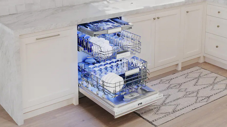 A Thermador dishwasher lighting up its racks