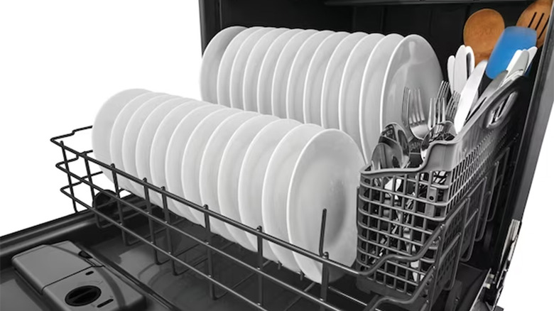 The bottom rack of a Frigidaire dishwasher