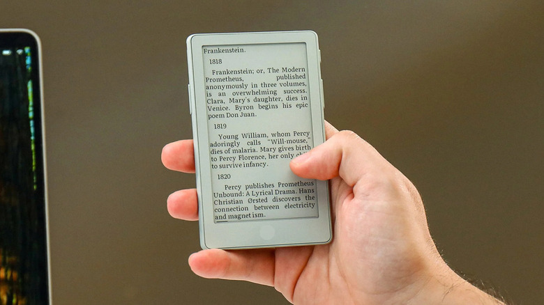 A white Xteink X4 Pro e-reader in the a person's hand