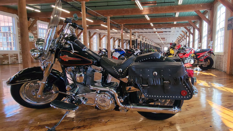 A blue-grey Softail classic from 1984-1985 generation lineup being displayed at an auto museum