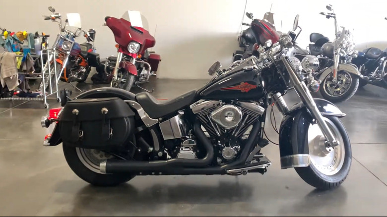 A 1995 Heritage Softail Classic in black paint being displayed indoors