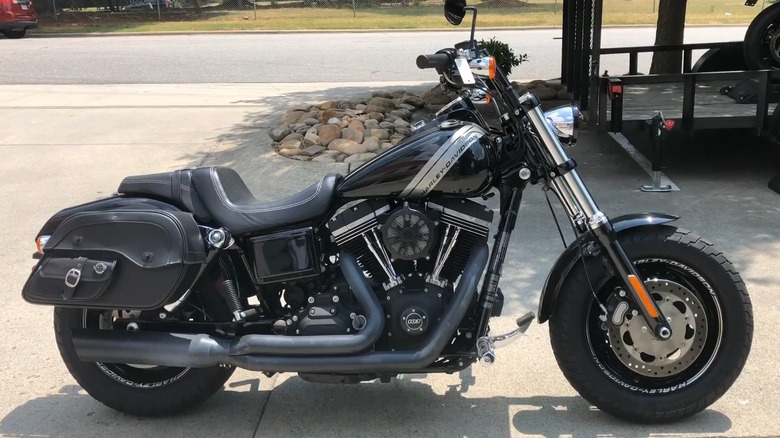 A black Harley-Davidson Dyna Fat Bob (2014) parked by the road