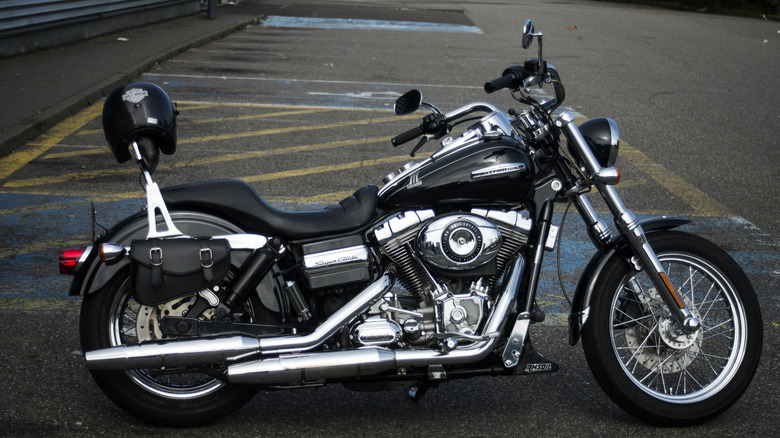 Black Harley-Davidson Dyna Super Glide Custom (2011) standing in parking area