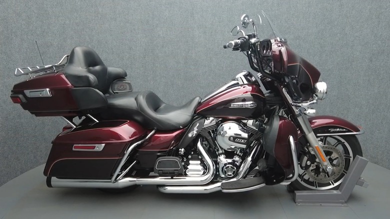 A red Harley-Davidson Electra Glide Ultra Classic (2014) parked
