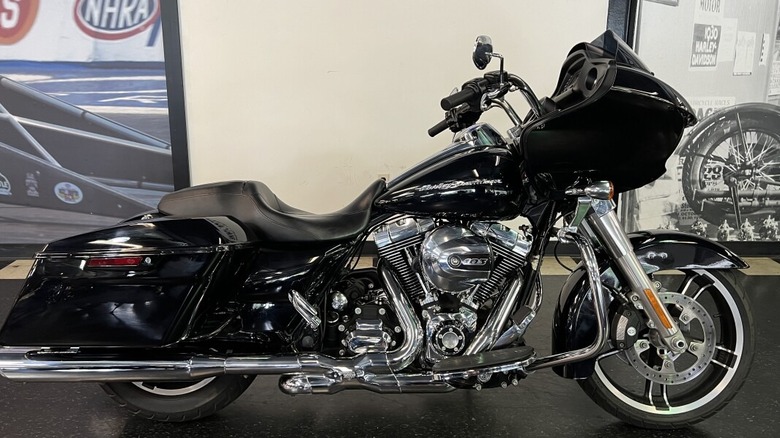 A black Harley-Davidson Road Glide (2015) parked in a mountainous road