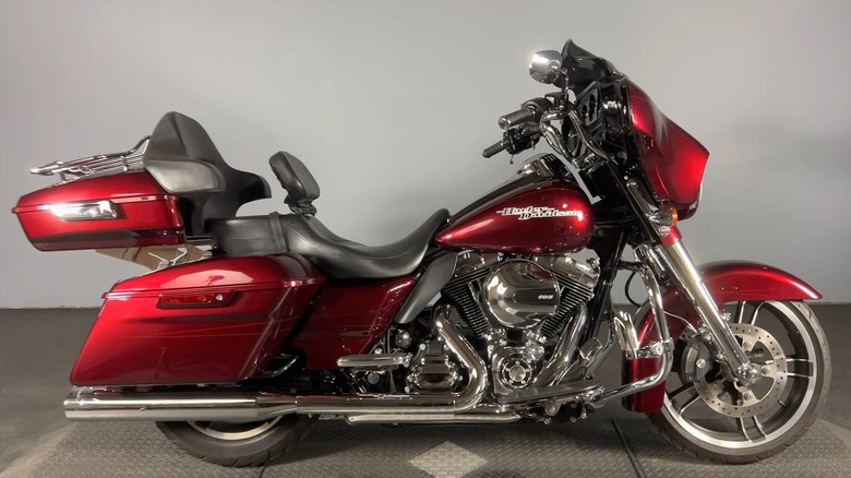 A red Harley-Davidson Street Glide (2014) inside a garage