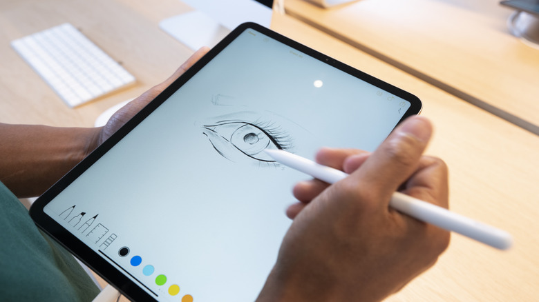 Someone drawing on iPad