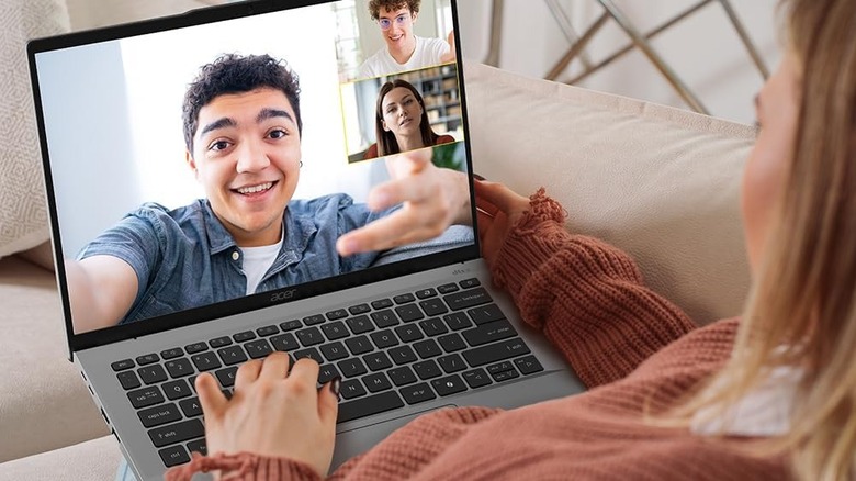 A woman video chatting on the Acer Swift Go.