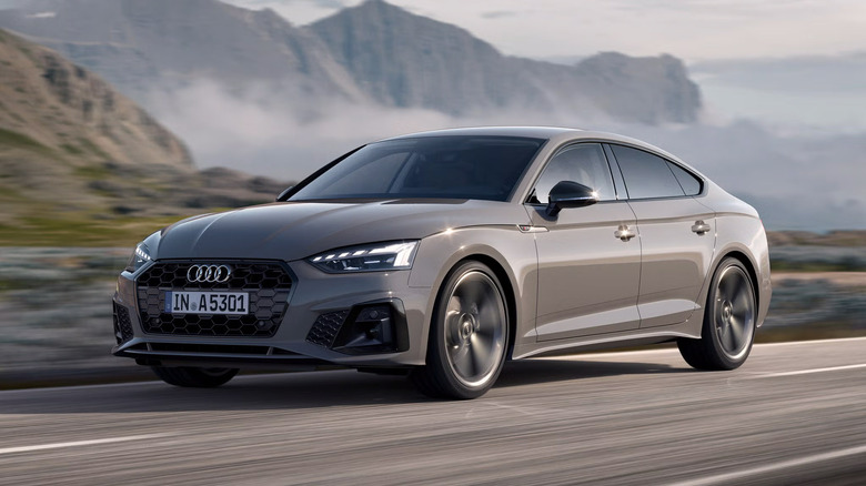 A gray Audi A5 Sportback driving