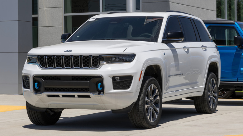 A white Jeep Grand Cherokee parked