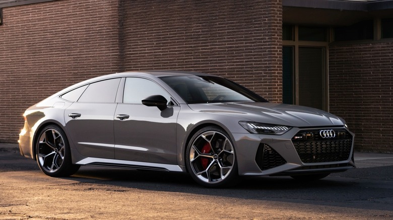 2024 Audi RS7 Performance in front of a modern bulding front 3/4 view