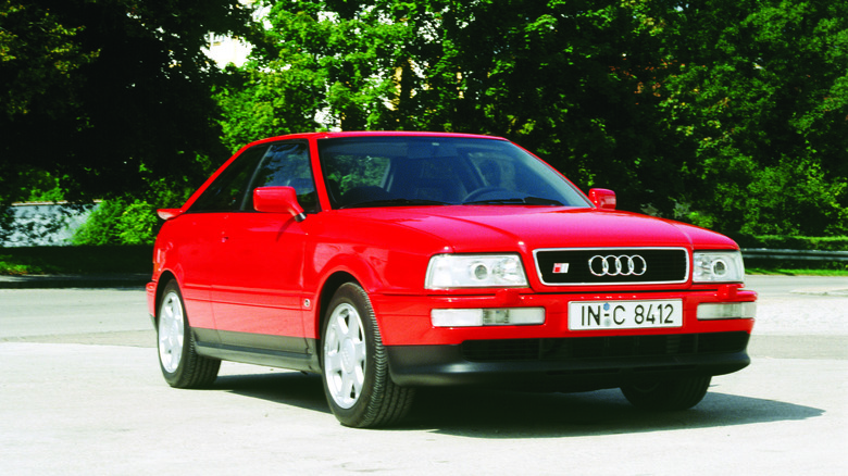 Red 1990 Audi S2 Coupe under the sun front 3/4 view