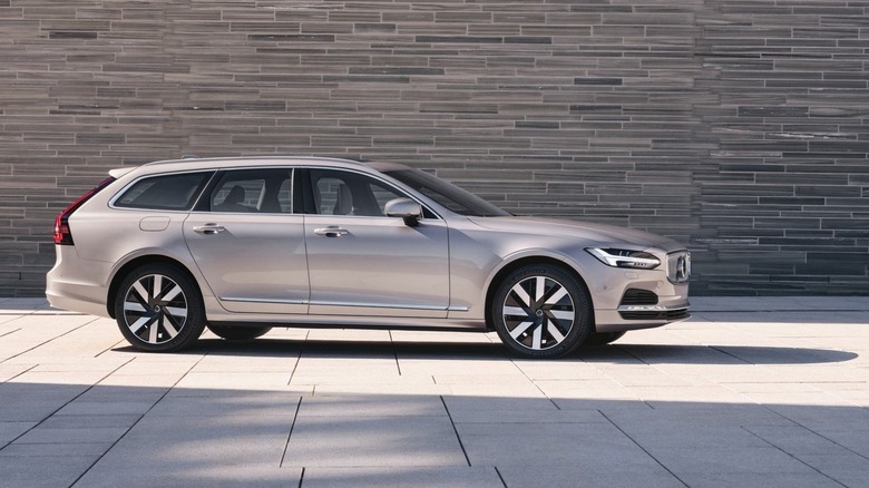 Volvo V90 in front of a brick wall front 3/4 to side view