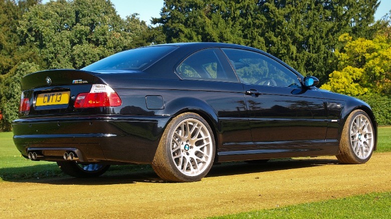 Black BMW M3 CSL parked on dirt road