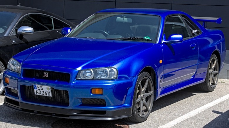 Blue Nissan Skyline R34 GT-R parked