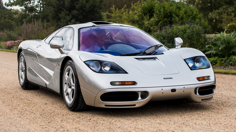 Silver McLaren F1 on gravel road