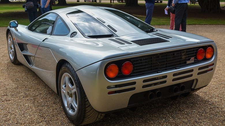 Rear end  3/4 view of a 1996 McLaren F1 parked in a park