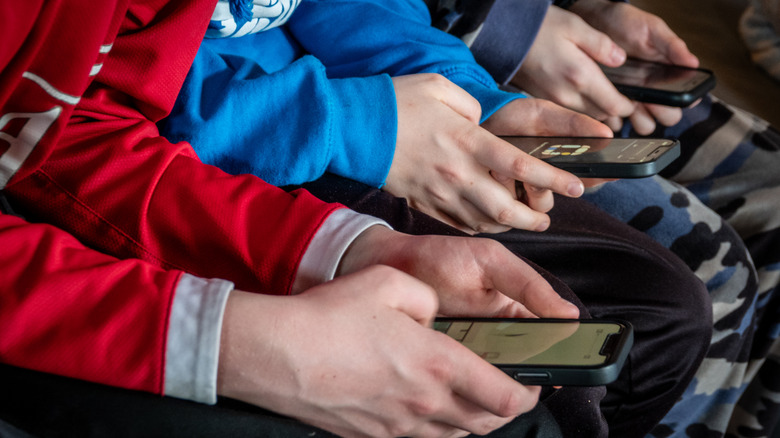 group of friends on phones